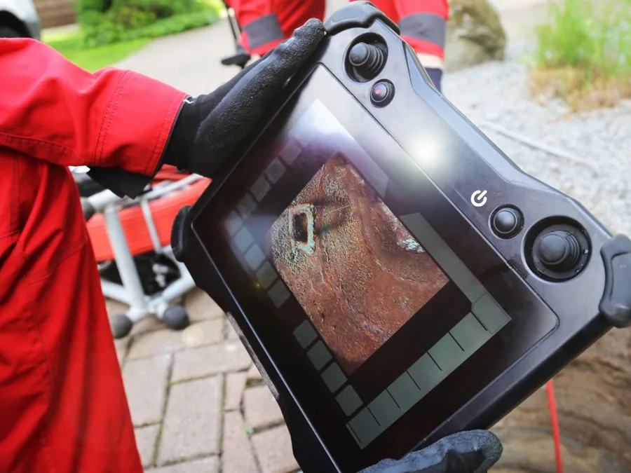 Handheld thermal camera used to inspect a suspected plumbing leak